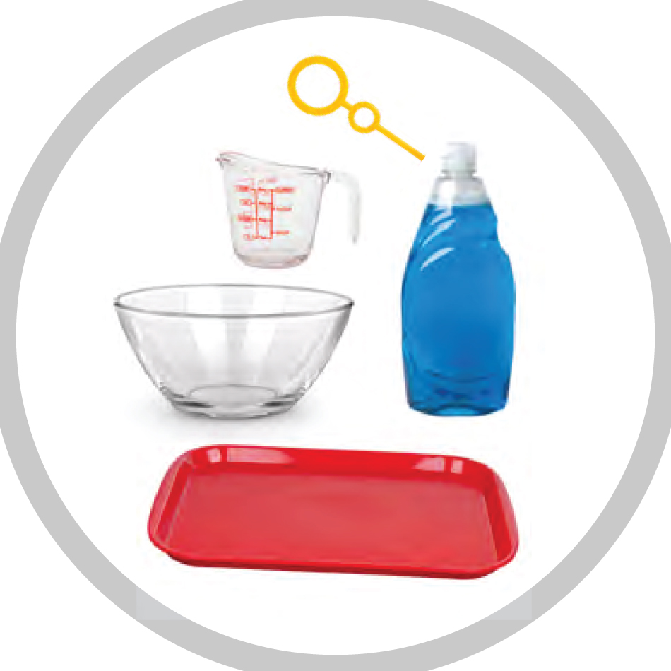 Materials needed for the ice orbs activity, including dish soap, a plastic tray, a large bowl, a measuring cup and a bubble wand.