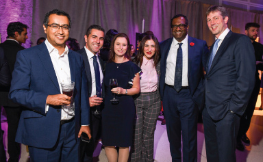 Six Innovators Ball guests pose for a photo.