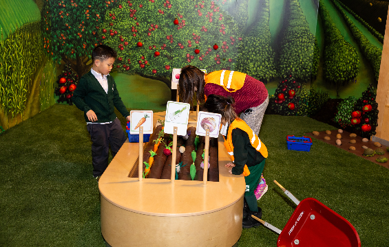 Kids playing in the town and country areas of the KidSpark.